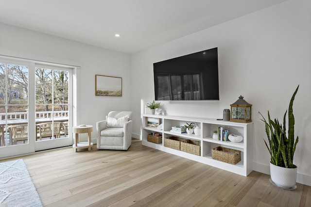 sitting room featuring light hardwood / wood-style floors