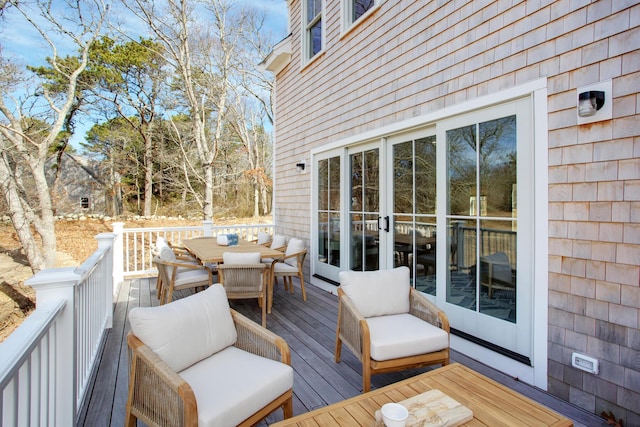 deck featuring outdoor dining area