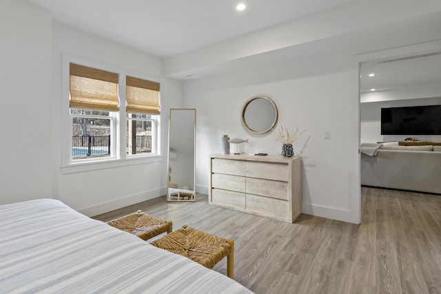 bedroom with recessed lighting, baseboards, and light wood-style floors