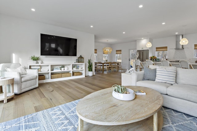 living area featuring recessed lighting and light wood-type flooring