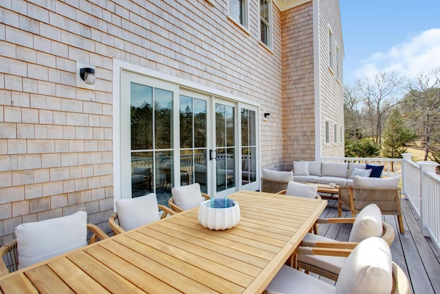 deck featuring outdoor lounge area and outdoor dining space