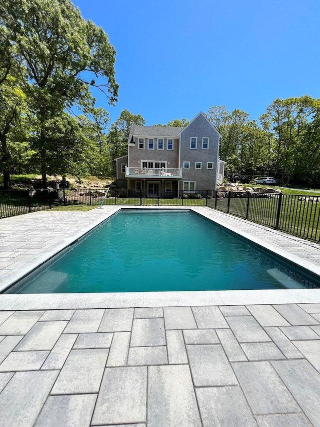 view of swimming pool with a fenced in pool, a patio, and fence private yard