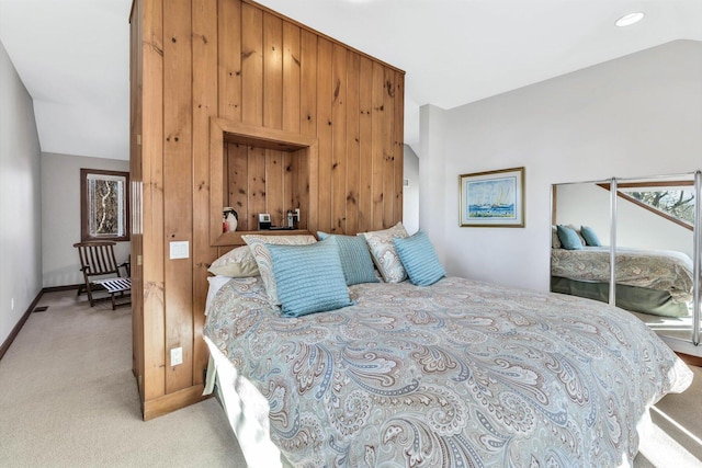 bedroom featuring light colored carpet and vaulted ceiling