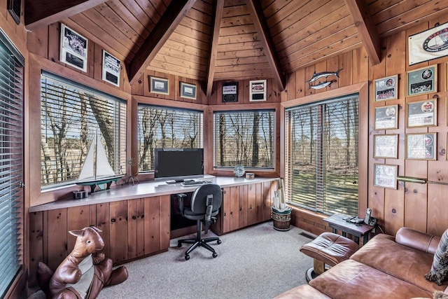 carpeted office featuring beamed ceiling, wooden walls, wooden ceiling, and high vaulted ceiling