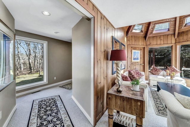 interior space with lofted ceiling with skylight