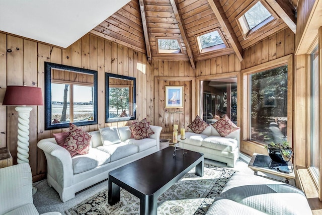 sunroom / solarium featuring wooden ceiling and lofted ceiling with skylight