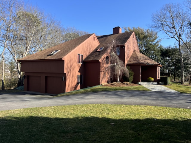 view of home's exterior featuring a yard and a garage