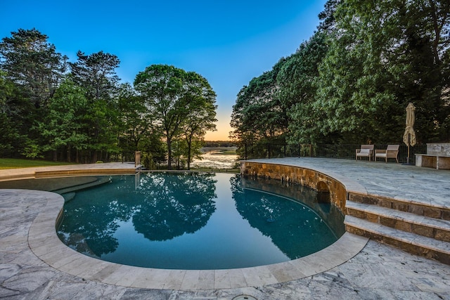 38 Beach Plum Hill Rd, Osterville, MA 02655 - pool at dusk featuring a patio area and an outdoor pool