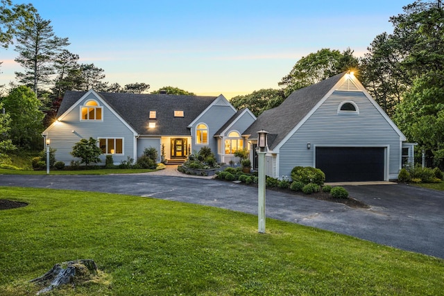 38 Beach Plum Hill Rd, Osterville, MA 02655 - view of front facade with a garage, asphalt driveway, a yard, and a shingled roof