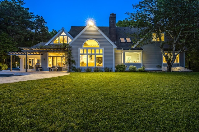 38 Beach Plum Hill Rd, Osterville, MA 02655 - back of house featuring a lawn, a pergola, a chimney, and a patio