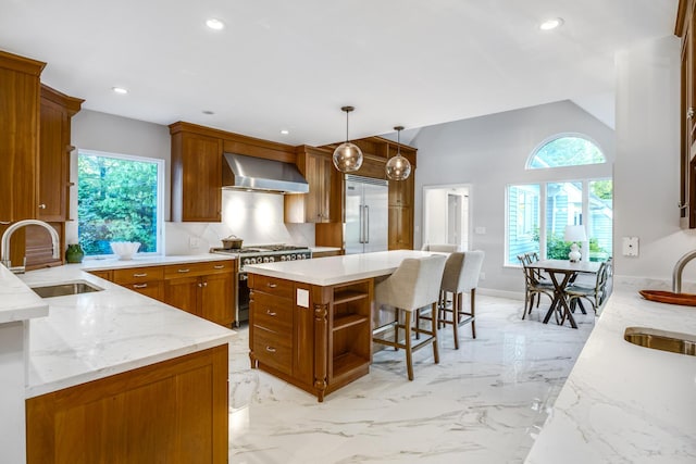 38 Beach Plum Hill Rd, Osterville, MA 02655 - kitchen with high end appliances, a sink, wall chimney exhaust hood, plenty of natural light, and recessed lighting
