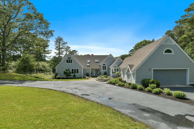 view of front of house featuring a front yard and a garage