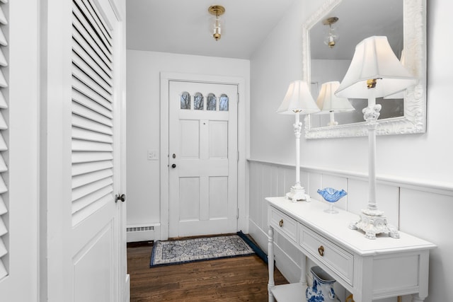 193 Main St, Sandwich, MA 02563 - doorway to outside with dark wood-style floors and a wainscoted wall