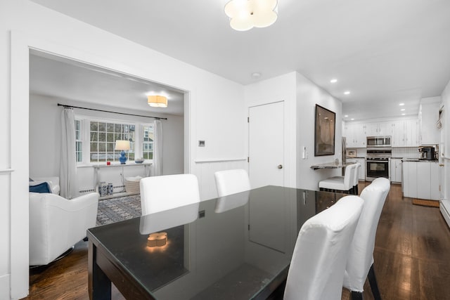 193 Main St, Sandwich, MA 02563 - dining space featuring dark wood-style flooring, a wainscoted wall, and recessed lighting