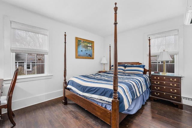 193 Main St, Sandwich, MA 02563 - bedroom with wood finished floors, a baseboard heating unit, baseboards, and multiple windows
