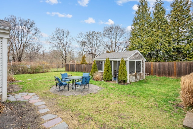 193 Main St, Sandwich, MA 02563 - view of yard with a patio, a fenced backyard, and an outbuilding