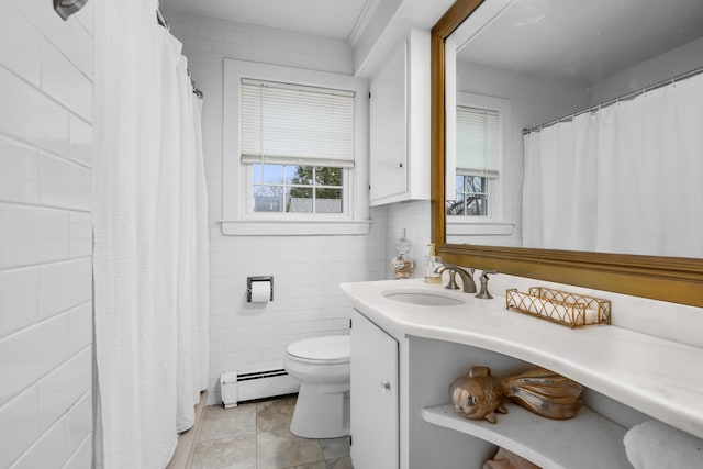 193 Main St, Sandwich, MA 02563 - bathroom with toilet, a baseboard radiator, vanity, and tile walls