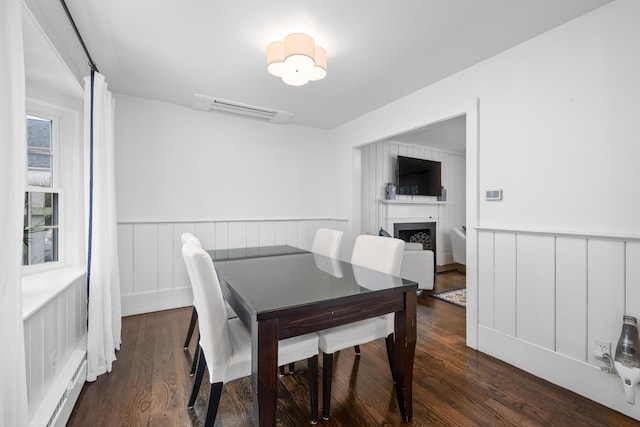 193 Main St, Sandwich, MA 02563 - dining space featuring a fireplace, wainscoting, and wood finished floors