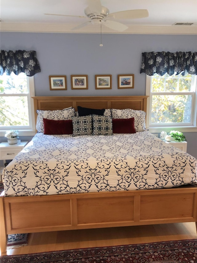 unfurnished bedroom featuring ceiling fan and crown molding