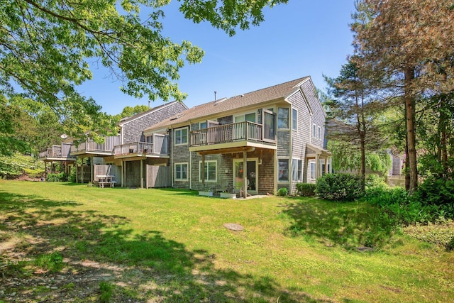 12 Wildflower Vlg, Yarmouth Port, MA 02675 - rear view of property featuring a yard and a wooden deck