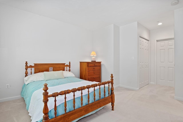 12 Wildflower Vlg, Yarmouth Port, MA 02675 - bedroom with light colored carpet, baseboards, and a closet