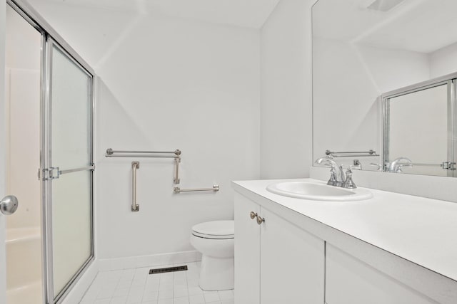 12 Wildflower Vlg, Yarmouth Port, MA 02675 - full bathroom featuring a shower with door, vanity, tile patterned flooring, toilet, and baseboards