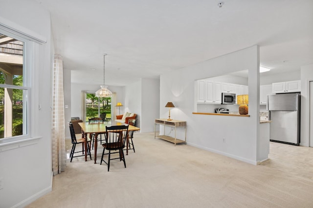12 Wildflower Vlg, Yarmouth Port, MA 02675 - dining area featuring baseboards and light carpet