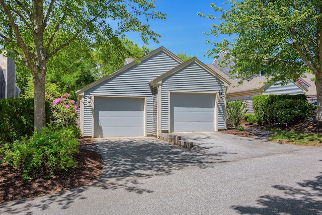 12 Wildflower Vlg, Yarmouth Port, MA 02675 - garage featuring asphalt driveway