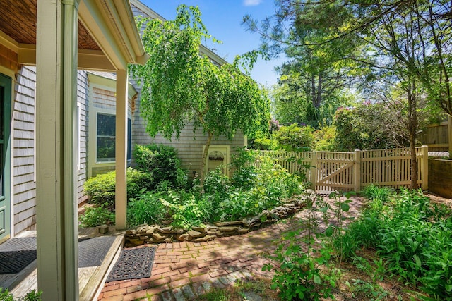 12 Wildflower Vlg, Yarmouth Port, MA 02675 - view of yard with a patio