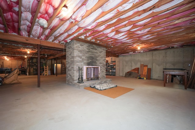51 Manitoba Rd, Mashpee, MA 02649 - unfinished basement with freestanding refrigerator and a brick fireplace