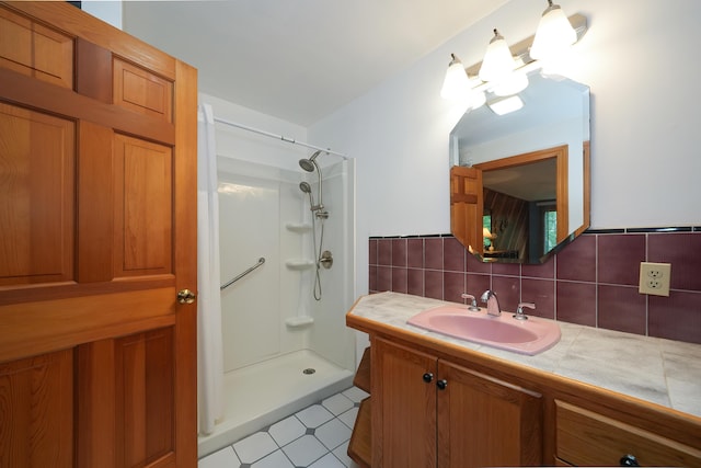 51 Manitoba Rd, Mashpee, MA 02649 - bathroom featuring a shower, vanity, and decorative backsplash