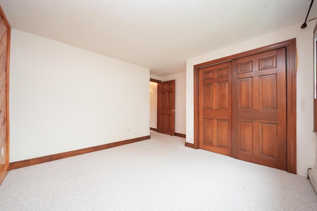 51 Manitoba Rd, Mashpee, MA 02649 - unfurnished bedroom featuring light colored carpet, a closet, and a baseboard radiator