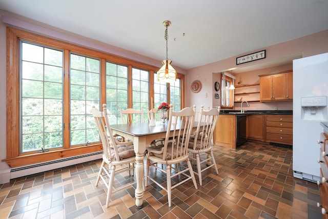 51 Manitoba Rd, Mashpee, MA 02649 - dining room with a baseboard heating unit and healthy amount of natural light