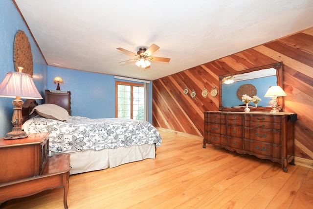 51 Manitoba Rd, Mashpee, MA 02649 - bedroom with wood walls, hardwood / wood-style flooring, and ceiling fan