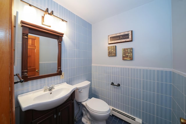 51 Manitoba Rd, Mashpee, MA 02649 - half bath featuring baseboard heating, tile walls, vanity, and a wainscoted wall