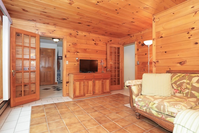 51 Manitoba Rd, Mashpee, MA 02649 - living area with light tile patterned floors, wooden walls, and wooden ceiling