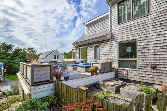 10 Westerly Dr, Bourne, MA 02532 - exterior space with a vegetable garden and an outdoor hangout area