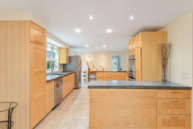 10 Westerly Dr, Bourne, MA 02532 - kitchen featuring recessed lighting, light brown cabinetry, light tile patterned floors, a sink, and appliances with stainless steel finishes