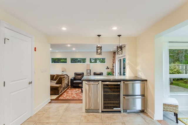 10 Westerly Dr, Bourne, MA 02532 - bar with decorative light fixtures, baseboards, wine cooler, and recessed lighting