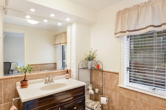 10 Westerly Dr, Bourne, MA 02532 - bathroom with tile walls, vanity, and wainscoting