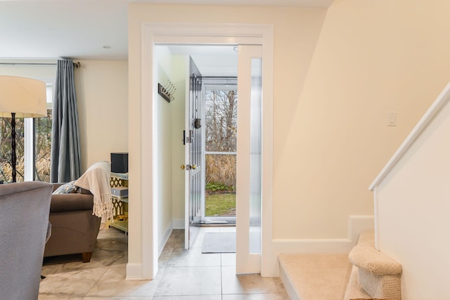 10 Westerly Dr, Bourne, MA 02532 - doorway to outside featuring baseboards, light tile patterned floors, and a healthy amount of sunlight