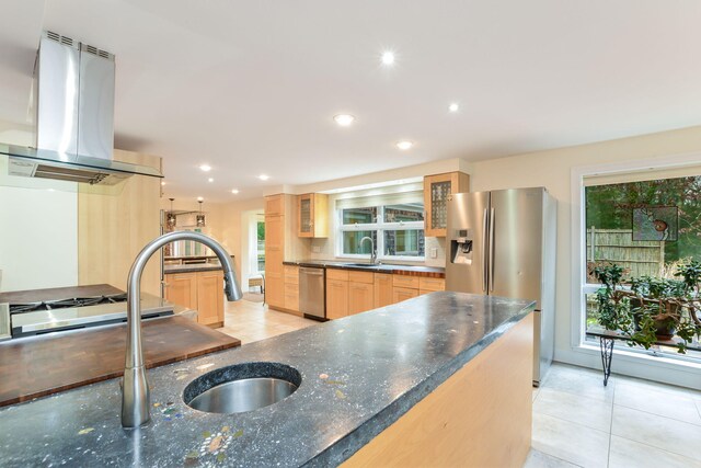 10 Westerly Dr, Bourne, MA 02532 - kitchen featuring stainless steel appliances, a sink, island range hood, glass insert cabinets, and light tile patterned floors
