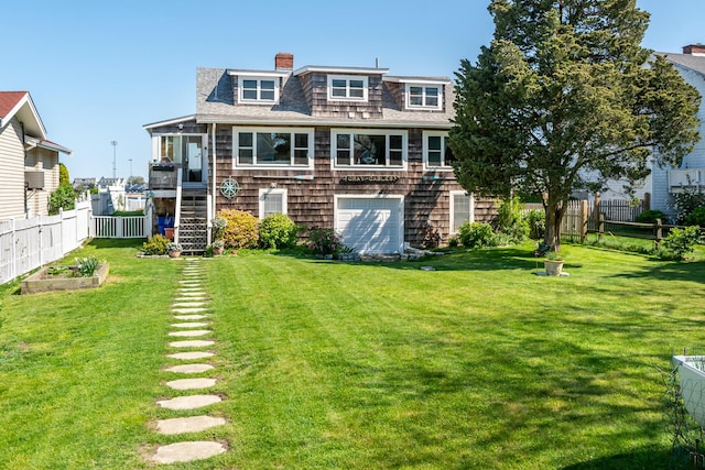 rear view of house featuring stairway, a shingled roof, and a chimney