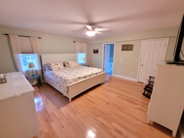 bedroom featuring light hardwood / wood-style flooring and ceiling fan