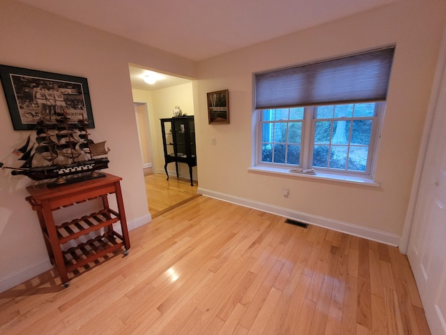 corridor featuring light hardwood / wood-style floors