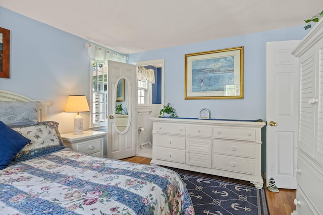 54 Mcnamara Ave, West Yarmouth, MA 02673 - bedroom featuring wood finished floors and connected bathroom