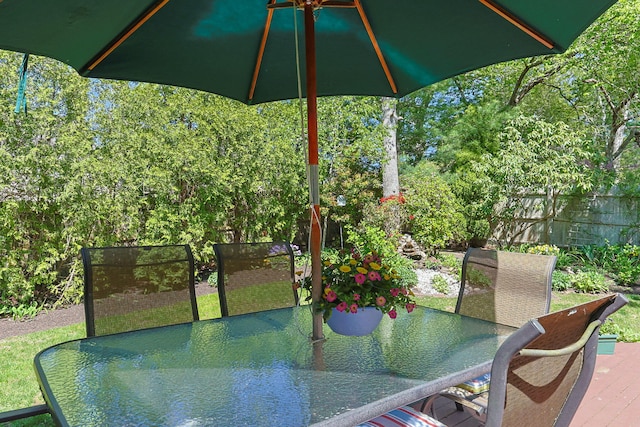 54 Mcnamara Ave, West Yarmouth, MA 02673 - view of patio with outdoor dining space and a wooden deck