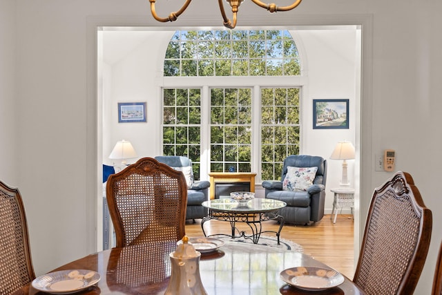 54 Mcnamara Ave, West Yarmouth, MA 02673 - living area with a chandelier and wood finished floors