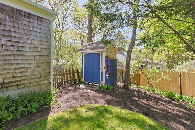 54 Mcnamara Ave, West Yarmouth, MA 02673 - view of shed with a fenced backyard