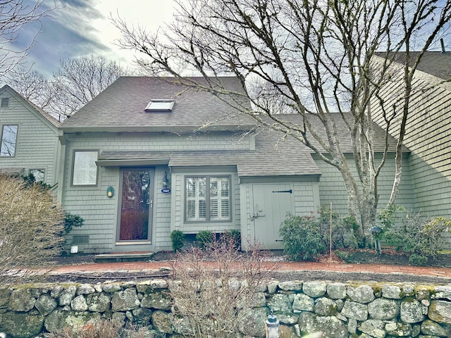 view of front of house featuring a shingled roof